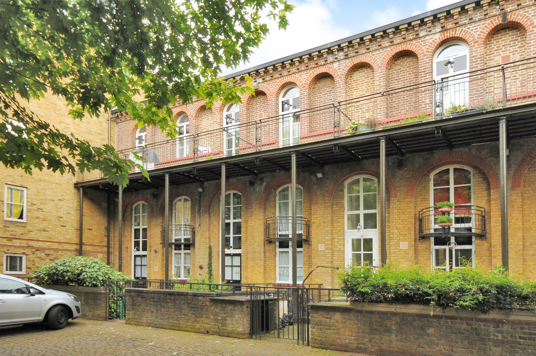 Exterior of the Islington apartment building in a quiet private square in Angel, London Zone 1