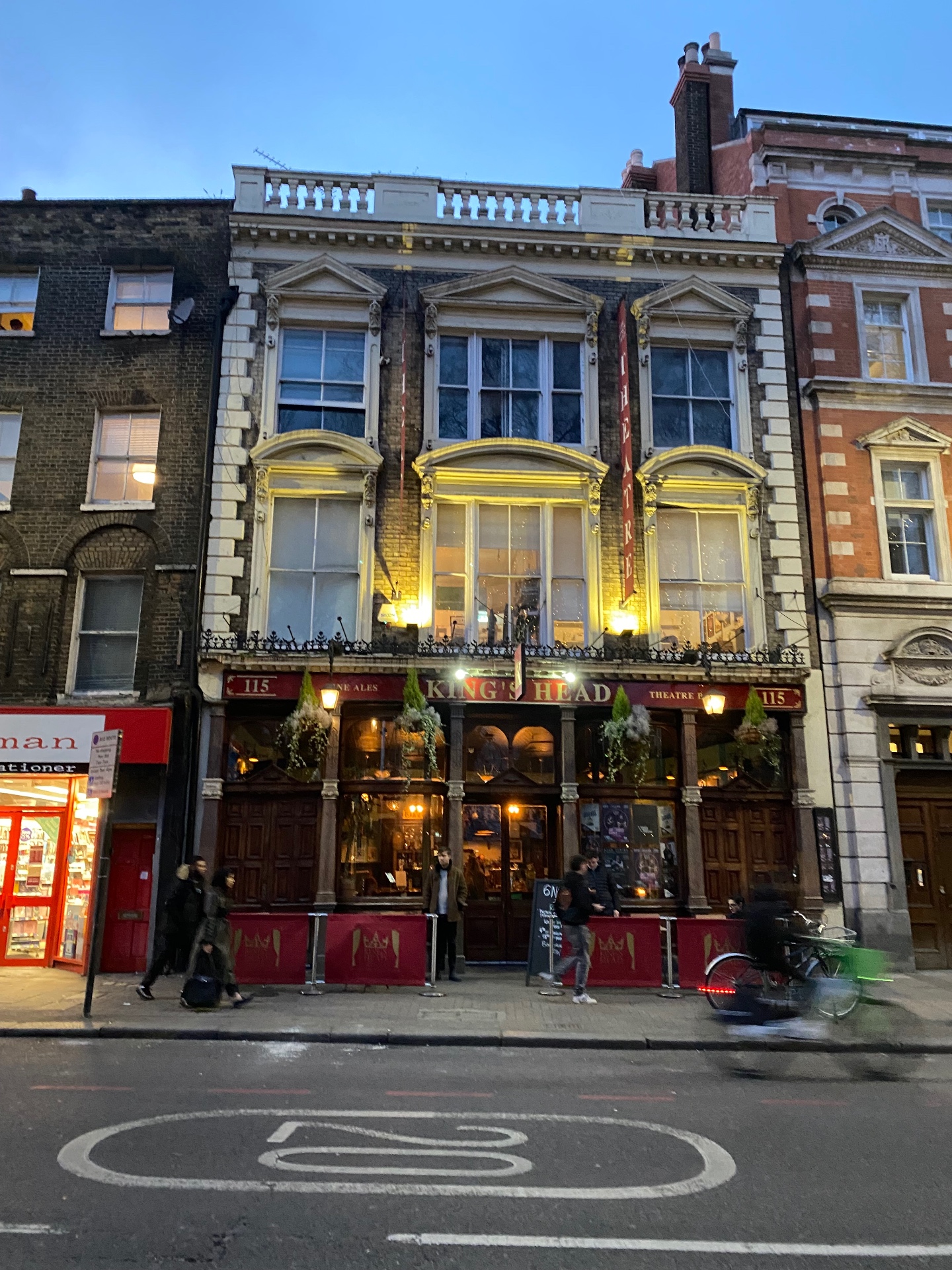 The King's Head Theatre pub lit up at dusk in Islington